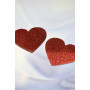 Paire de cache tétons adhésifs coeur pailleté rouge 